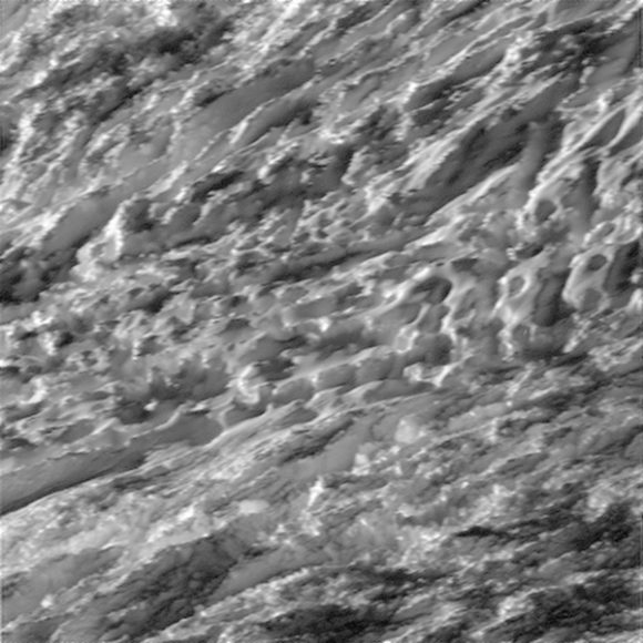 This view is centered on terrain at 57 degrees south latitude, 324 degrees west longitude. The image was taken in visible light with the Cassini spacecraft wide-angle camera on Oct. 28, 2015. The view was acquired at a distance of approximately 77 miles (124 kilometers) from Enceladus. Image scale is 49 feet (15 meters) per pixel.