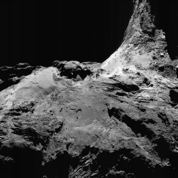 Enhanced NAVCAM image of Comet 67P/C-G taken on 25 June 2016, 16.7 km from the nucleus. The scale is 1.4 m/pixel and the image measures 1.5 km across. Credits: ESA/Rosetta/NAVCAM – CC BY-SA IGO 3.0 