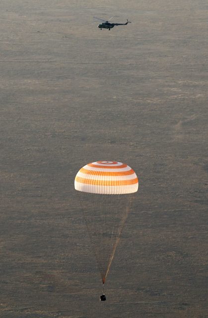 A landing module of the Russian Soyuz TMA-19M space craft carrying  crew of the International Space Station Russian cosmonauts Alexei Ovchinin, Oleg Skripochka and US NASA astronaut Jeffrey Williams lands some 150 km. to the East of the city of Dzhezkazgan in Kazakhstan, 07 September 2016.
